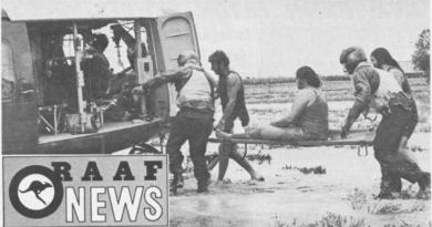 Royal Australian Air Force members help a civilian during the nationwide floods in 1974.