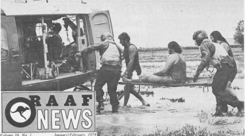 Royal Australian Air Force members help a civilian during the nationwide floods in 1974.