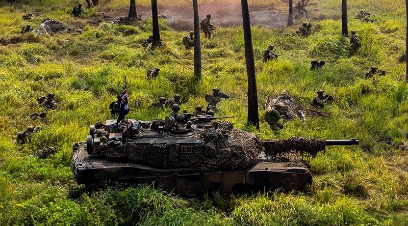 Australian Army M1A1 Abrams tank and Australian Army personnel from the Amphibious Force and Indonesian National Armed Forces marines move inland from Banongan Beach, East Java, during Exercise Keris Woomera 2024. Photo by Andrew Green.
