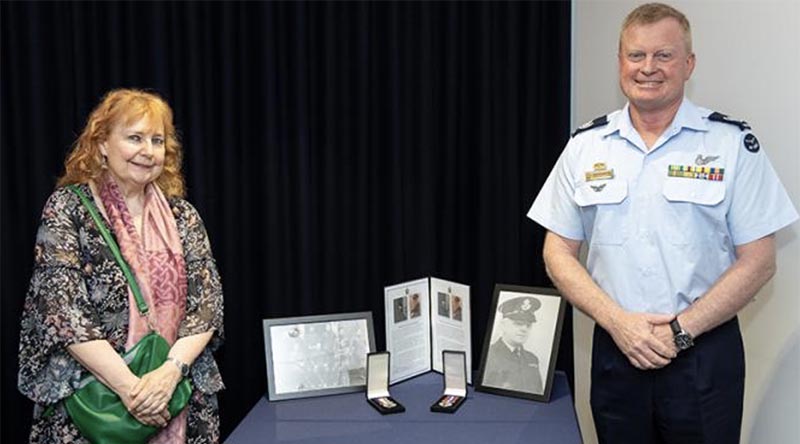 Warrant Officer of the Air Force Warrant Officer Ralph Clifton presents acting Flight Lieutenant Thomas James Carmody’s Australian Service Medal 1939–1945 and War Medal 1939–1945 to Julie Carmody. Photo: Aircraftman Jakob Reid.