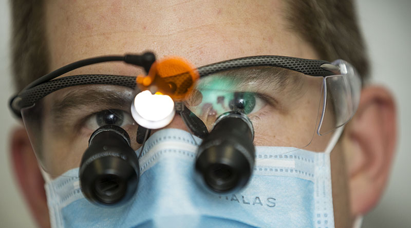 Australian Army officer Captain Steve Ceccato, a dentist in the field hospital facility at the Shoalwater Bay Training Area in North Queensland during Exercise Talisman Saber. Photo by Leading Seaman Jake Badior.