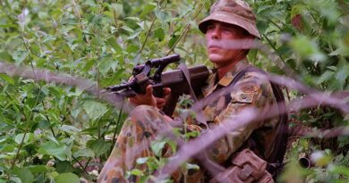 Private Mathew Guy, A Company, 3RAR, keeps a keen eye on suspected militia activity across the border in West Timor, from East Timor's Oecussi Enclave. Photo by Corporal Brian Hartigan.